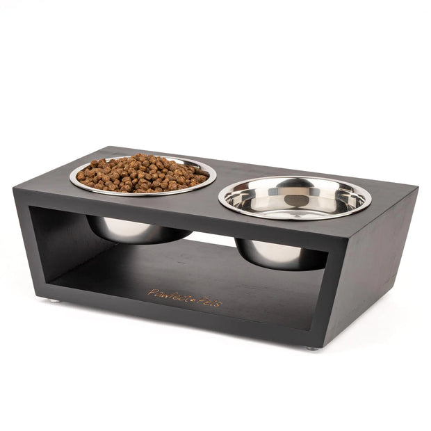 Pet feeding station with two bowls on a white background