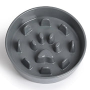Gray pet bowl with paw print design on a white background