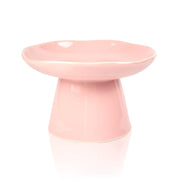 Pink ceramic dish on a white background